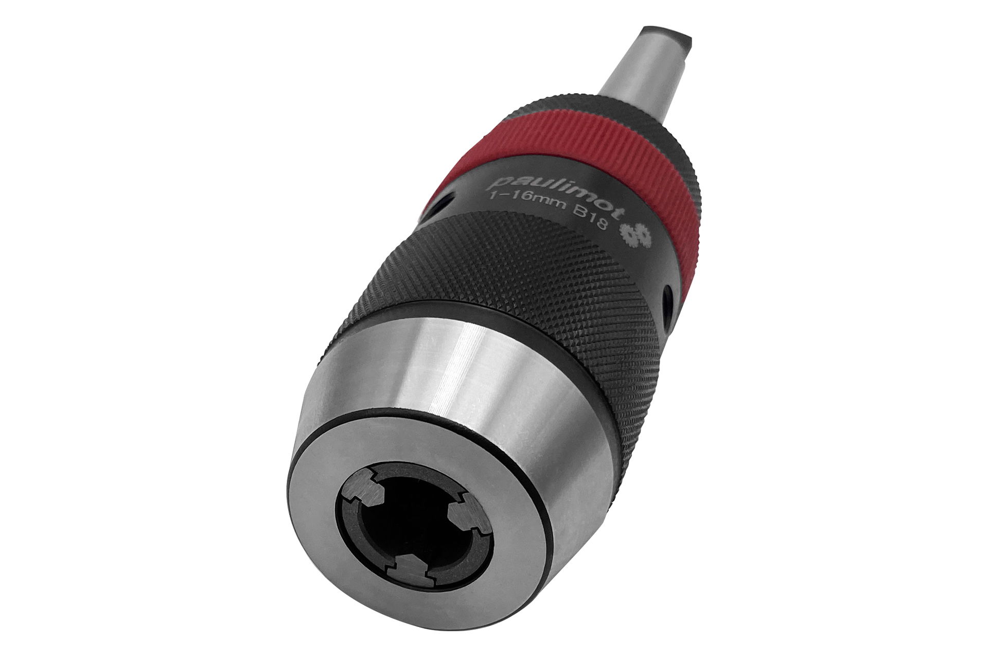 A quick-release drill chuck in black and silver with a red ring lies diagonally against a white background. The opening is visible.